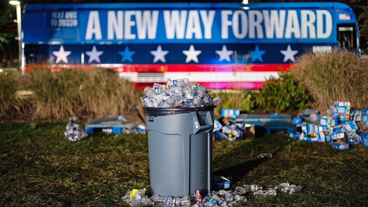 Chairs and trash sit in an empty field after the election night watch party for Democratic presidential nominee