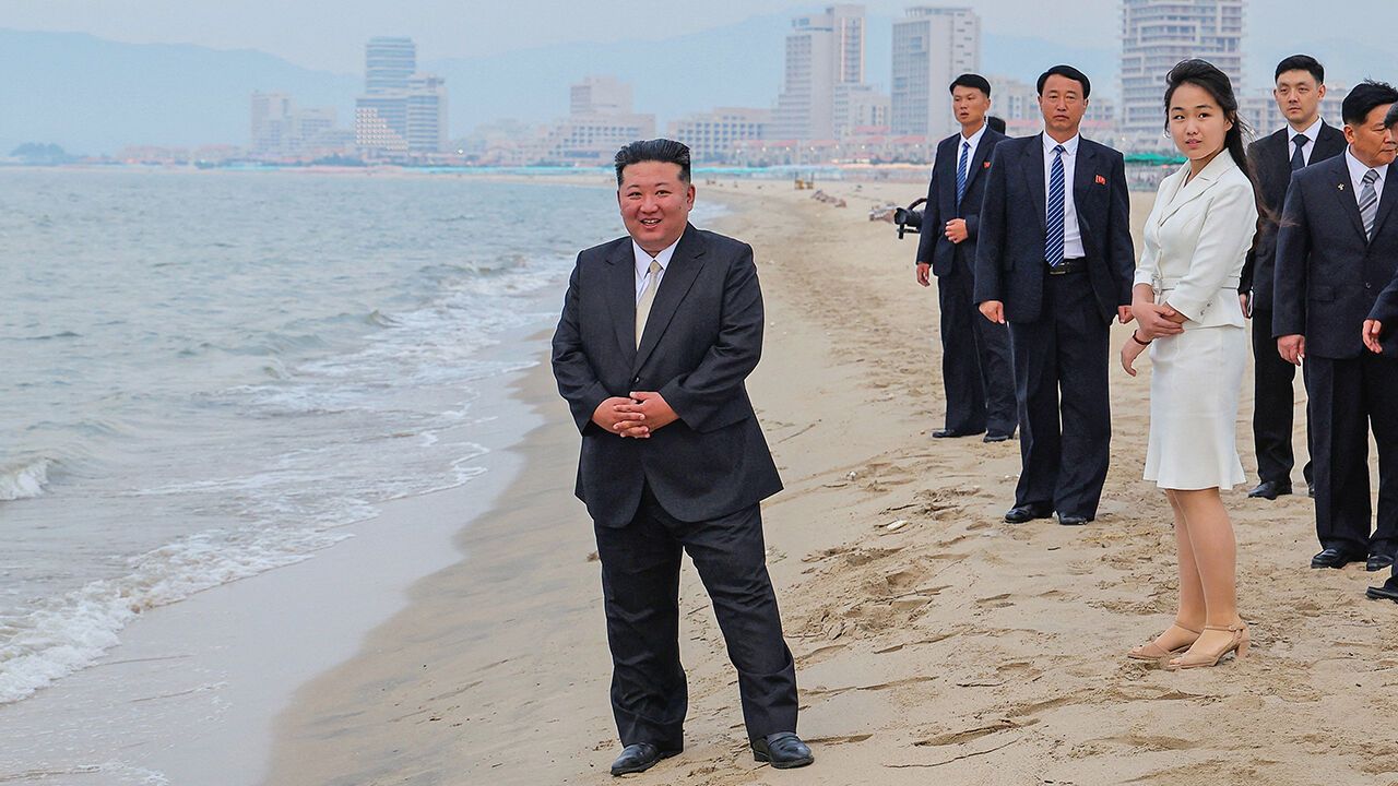North Korean leader Kim Jong Un and his daughter Kim Ju Ae stand on the beach during a ceremony to celebrate the completion of the Wonsan Kalma Coastal Tourist Zone, in Wonsan