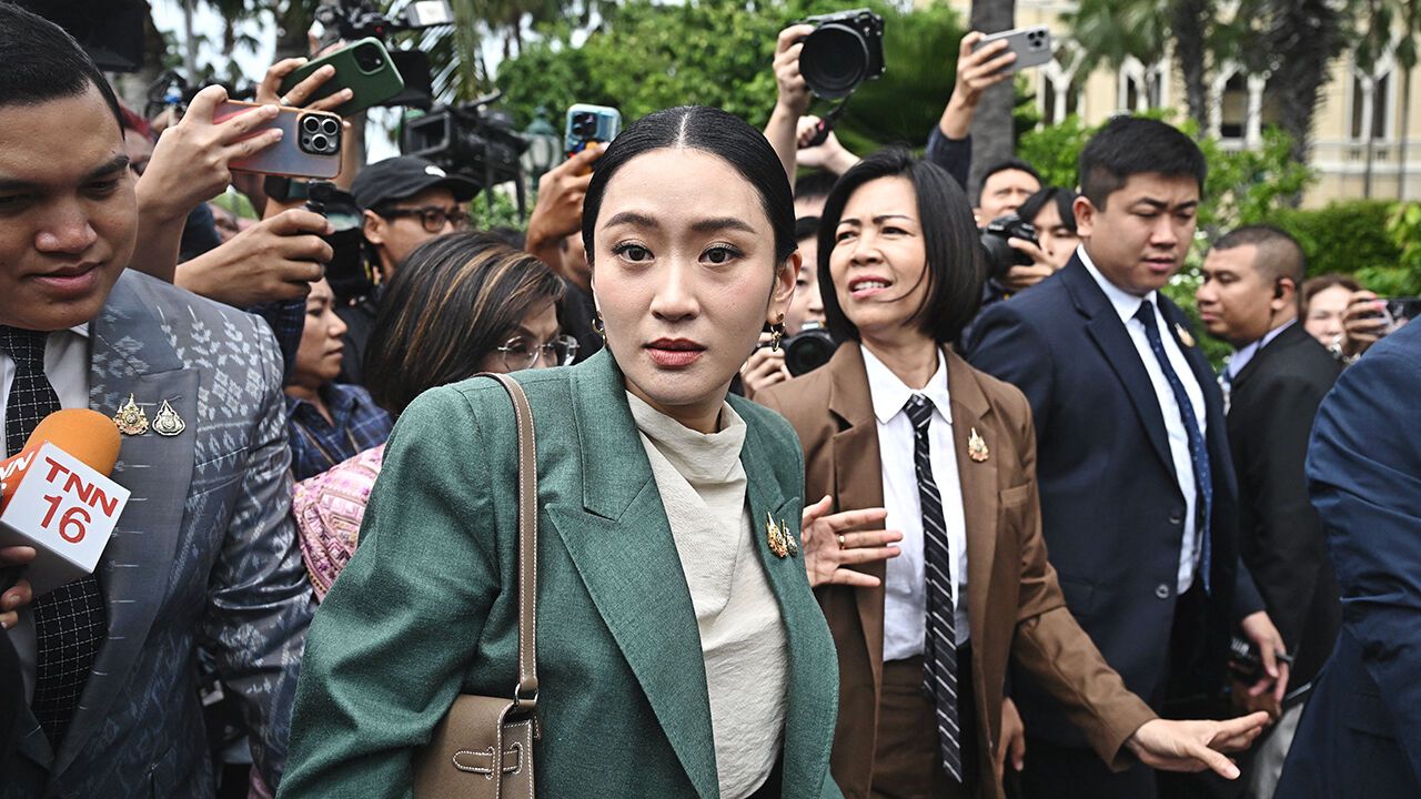 Thailand's Prime Minister Paetongtarn Shinawatra walks through the Government House after a cabinet meeting in Bangkok